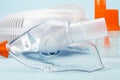 Transparent respiratory mask for compressor inhaler on blue close up