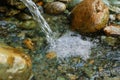 Waterfall, spring, river with stones outdoors