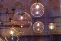 Transparent round lampshades with incandescent bulbs. design illumination Royalty Free Stock Photo