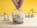 Transparent see through piggy bank filled with coins on white background. Royalty Free Stock Photo