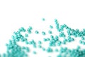 Transparent seed beads aquamarine color scattered on a white surface close-up Royalty Free Stock Photo