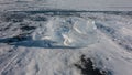 Transparent shards of ice on a frozen lake.