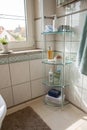 Transparent shelf installed in bathroom corner Royalty Free Stock Photo