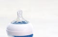The transparent silicone teat of a blue baby bottle Royalty Free Stock Photo