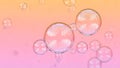 Transparent soap bubbles with pink and orange reflections floating against a gradient background image Royalty Free Stock Photo