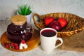 Transparent teapot and cup with red tea with raspberries and apples. Detox antioxidant home health drink. Copy space Royalty Free Stock Photo