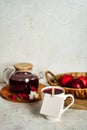 Transparent teapot with red tea with raspberries and apples. Detox antioxidant home health drink. Copy space Royalty Free Stock Photo