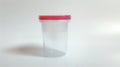 Transparent urine sample container with blue lid. Laboratory urine test cup for medical analysis. Concept of healthcare Royalty Free Stock Photo