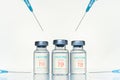 Transparent vials, syringes with new vaccine for covid-19 coronavirus, flu, infectious diseases. Injection after clinical trials