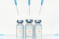 Transparent vials, syringes with new vaccine for covid-19 coronavirus, flu, infectious diseases. Injection after clinical trials
