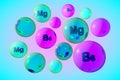 Transparent vitamin B6 and magnesium pills on colorful background. Pyridoxine and magnesium capsules. Vitamin and