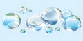 Transparent water bubbles floating on light blue backgroundClean pure aqua spheres design element Royalty Free Stock Photo