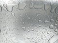 Transparent water drops background. Wet, gray and opaque glass texture. Condensed rain drops