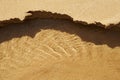 Transparent water ripple, sand waves and sunlight glare with sandslide. Royalty Free Stock Photo