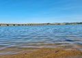 Transparent waters of a river, with blue sky