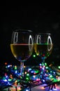 selective focus. Wine glasses in the light of Christmas lights Royalty Free Stock Photo