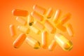 Transparent yellow fish oil capsules. Vitamin and mineral complex. 3d illustration
