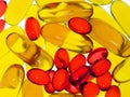 Transparent yellow and red capsules.