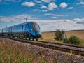 A Transpennine Express train travelling at speed in Northumberland, UK