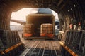 Transport aircraft in the airport cargo terminal. Large bales on trolleys ready for loading from hangar into the Royalty Free Stock Photo