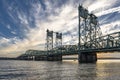 Transport arched truss drawbridge across the Columbia River against a cloudy sky at sunset Royalty Free Stock Photo