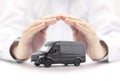 Transport black van car protected by hands Royalty Free Stock Photo