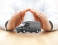 Transport black van car protected by hands Royalty Free Stock Photo