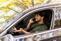 transport, communication and people concept. Indian man or driver driving car and calling on smartphone