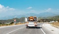 Transport and deliver new or broken tractor to the farm in a small truck. Agriculture business and machine industry Royalty Free Stock Photo