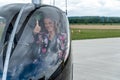 Transport by helicopter. young woman on a private flight