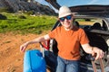 Transport, leisure, road trip and people concept - happy man enjoying road trip and summer vacation. Royalty Free Stock Photo
