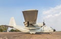 Transport military cargo aircraft parked standby ready to takeoff on sunset time Royalty Free Stock Photo