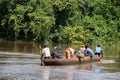 Transport of people across the Mbari river by locally made canoes and by ferry boat, Central African Republic