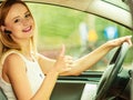 Woman driving car with headset Royalty Free Stock Photo