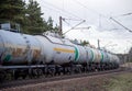 Transport tank car LNG by rail, gas - oil products. LPG transport propane. The fuel train, rolling stock with petrochemical tank Royalty Free Stock Photo
