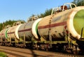 Transport tank car LNG by rail, gas - oil products. LPG transport propane. The fuel train, rolling stock with petrochemical tank Royalty Free Stock Photo