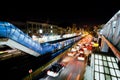 Transport traffic with lights of cars on the busy street of night urban city Royalty Free Stock Photo