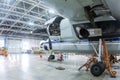 Transport turboprop airplane in the hangar. Aircraft under maintenance