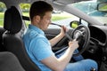 Man or car driver fastening seat belt