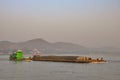 Transport and workers on boat on Irrawaddy River in Burma Royalty Free Stock Photo