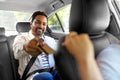 indian man giving credit card to taxi car driver Royalty Free Stock Photo