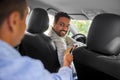 taxi car driver taking credit card from passenger Royalty Free Stock Photo