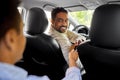 taxi car driver taking credit card from passenger Royalty Free Stock Photo