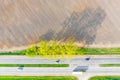 Transportation concept. Dry farmland near road. Tree shadows Royalty Free Stock Photo