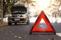 Red triangle, red emergency stop sign, red emergency symbol and  car stop and park on road Royalty Free Stock Photo