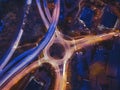 Transportation, drone long exposure shot of cars on road intersection by night. Royalty Free Stock Photo