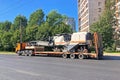 Transportation of equipment for cutting and removing old asphalt pavement for road repair truck platform of a truck trailer on