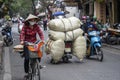 Transportation of goods by motorcycle on the street in old town Hanoi, Vietnam Royalty Free Stock Photo