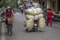 Transportation of goods by motorcycle on the street in old town Hanoi, Vietnam Royalty Free Stock Photo