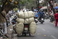 Transportation of goods by motorcycle on the street in old town Hanoi, Vietnam Royalty Free Stock Photo